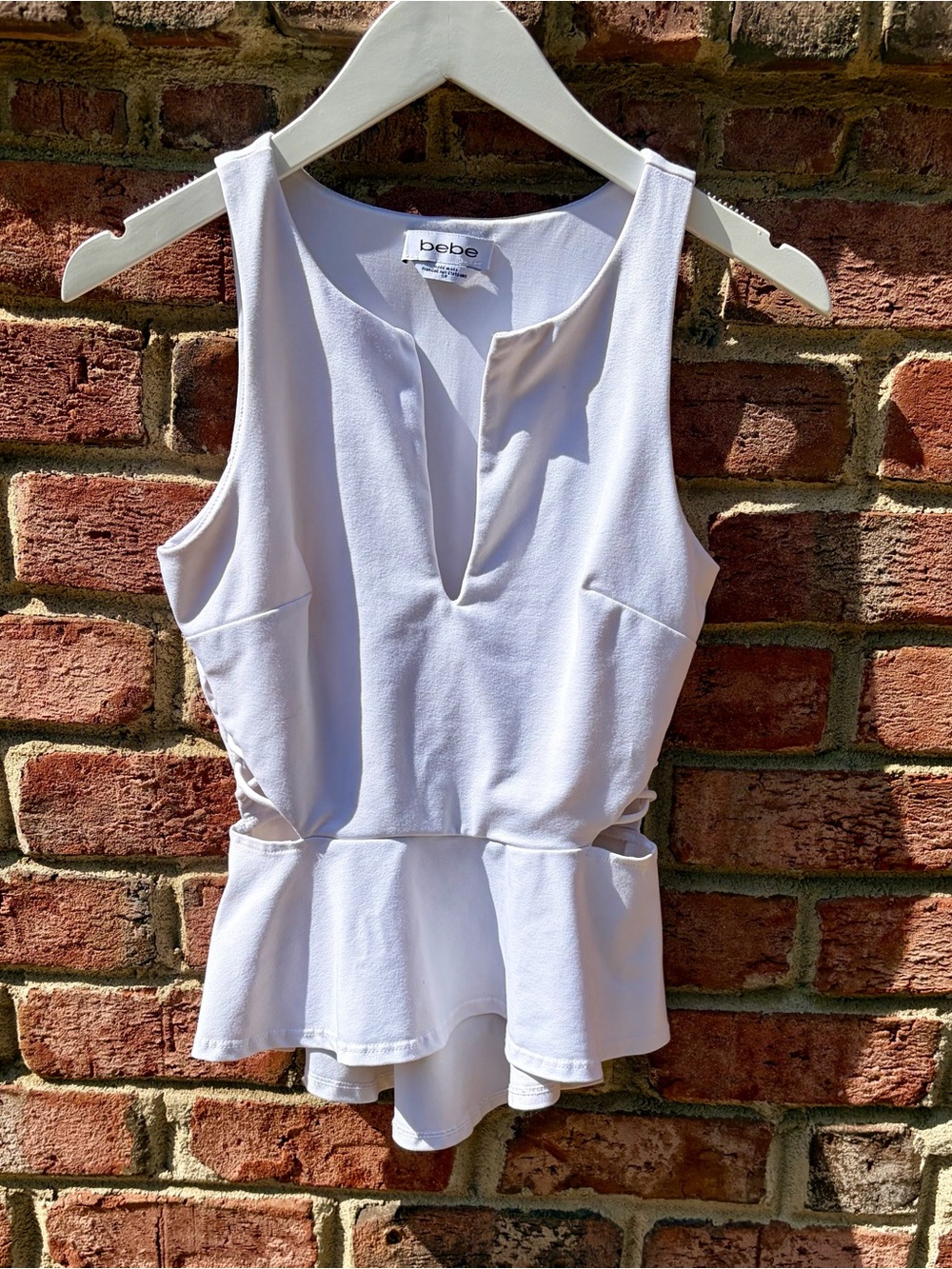 bebe White Sleeveless Peplum Camisole with V-Notch